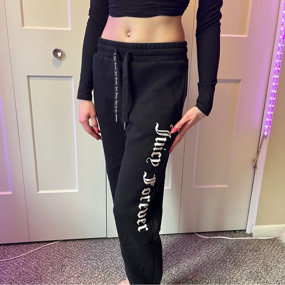 Black fleece, tie waist joggers with white “Juicy Forever” lettering. Size xs